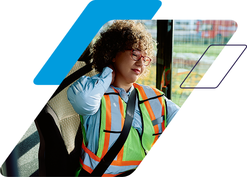fatigued driver rubbing the back of her neck 