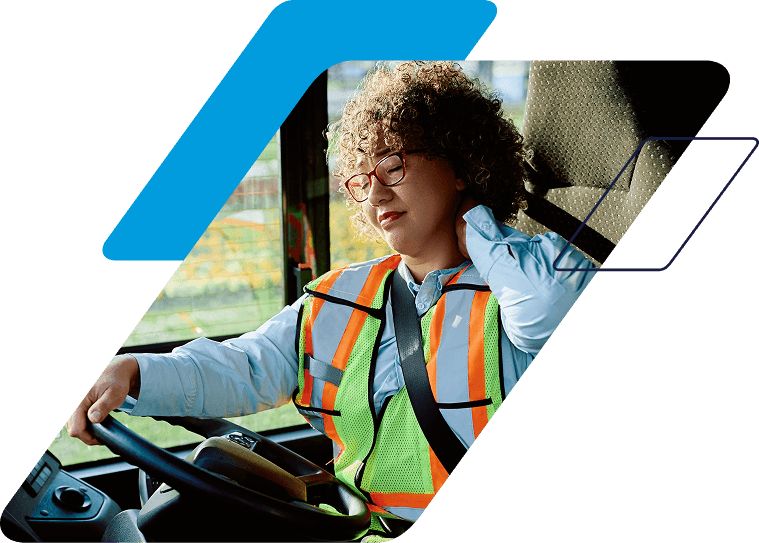 fatigued driver rubbing the back of her neck 